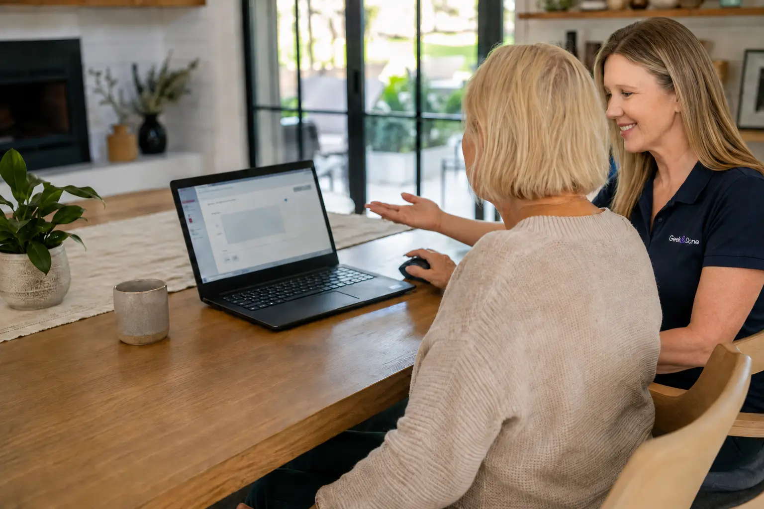 Two adults learning together at a laptop